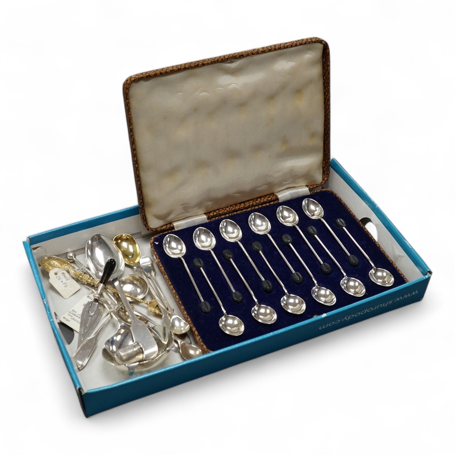 Assorted collectable silver including a trowel bookmark with agate handle, Birmingham, 1901, 96mm, a tea strainer, Coronation spoons and other flatware including a cased set of twelve bean end coffee spoons. Condition -